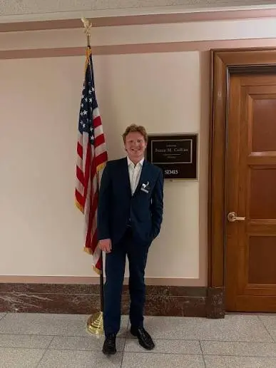 Zak Asplin-Mounter standing outside Senator Susan Collins’s Capitol office during a Maine College Republicans visit.
